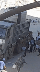 Water distribution from a truck in Khan Yunis, Gaza