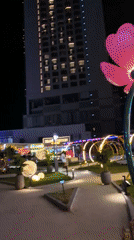 Đà Nẵng plaza glows at night with lanterns, fountains, and murals