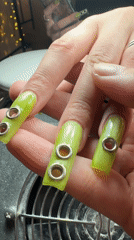 Belgrade resident shows off lime green nails with silver accents