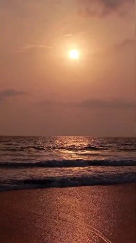 Sunset documented at Querim beach, India with coastal scenes