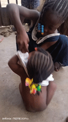 Children at rest on concrete floor in Akwanga