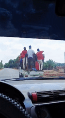 Pickup truck transports multiple passengers in rural Nigeria