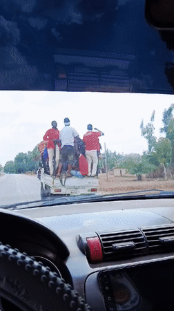 Pickup truck transports multiple passengers in rural Nigeria