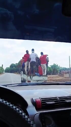 Pickup truck transports multiple passengers in rural Nigeria