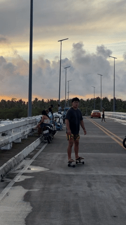 Bridge becomes recreational hub during sunset in General Luna