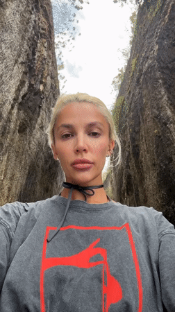 Woman photographed on scenic tropical road in Kuta Selatan