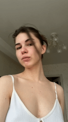 Woman recorded making hand gestures indoors in Saint Petersburg