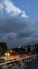 Storm clouds and moonlight over Belgrade at dusk