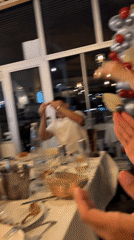Group celebrates at restaurant table in Sozopol, Bulgaria
