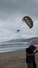 Patong Beach on a cloudy morning, waves rolling in