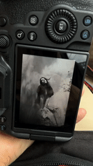 Person views black and white portrait on camera in Leeds