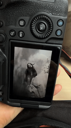 Person views black and white portrait on camera in Leeds
