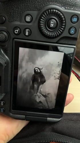 Person views black and white portrait on camera in Leeds