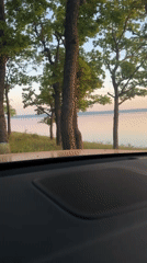 Lake sunset captured on video from car dashboard