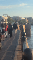 Astrakhan waterfront buzzes with families, music, boats on sunny afternoon