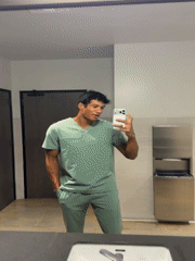 Man in scrubs takes selfie in El Segundo restroom