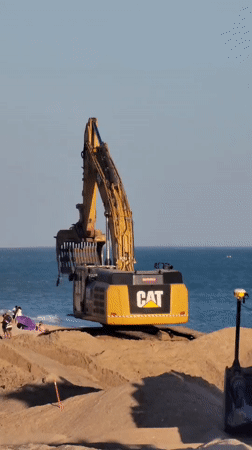 Beach replenishment underway at Quarteira as Van Oord dredger works offshore