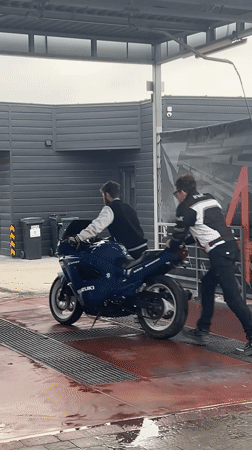 Motorcycle maintenance and washing documented in Horodok, Ukraine