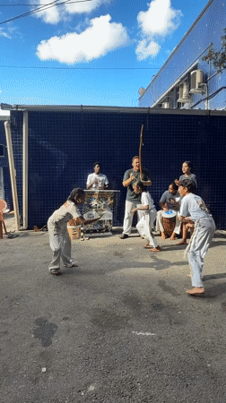 Capoeira group performs street demonstration in Rio favela