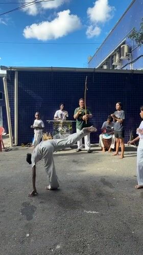 Capoeira group performs street demonstration in Rio favela
