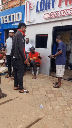 Routine street gatherings captured near Jos electronics shops