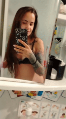 Woman records morning routine selfie in Russian bathroom