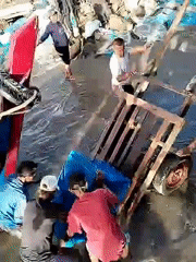 Fishermen Load Equipment at Lhokseumawe Harbor During Early Morning Operations