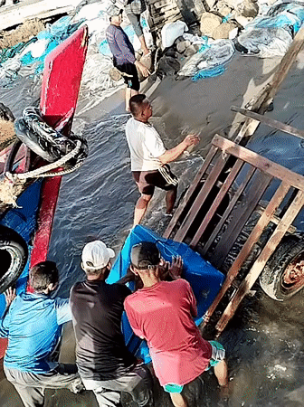 Fishermen Load Equipment at Lhokseumawe Harbor During Early Morning Operations