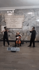 String trio performs classical music at Moscow metro station