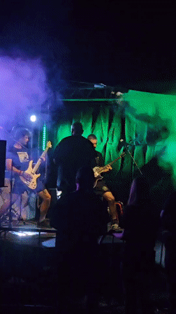 Live band plays outdoor stage in Prešov under colorful lights