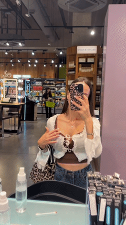Browsing and testing skincare products at a Saint Petersburg boutique
