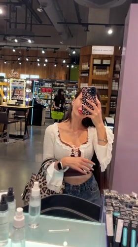 Browsing and testing skincare products at a Saint Petersburg boutique