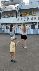 Cruise ship passengers wave, dance during Chaikovsky port stop