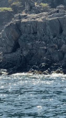 Cruising Santa Marta's rocky coastline by boat