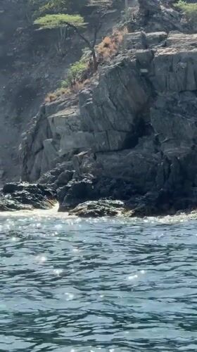 Cruising Santa Marta's rocky coastline by boat