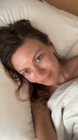 Woman with thermometer documented in North Kuta bedroom