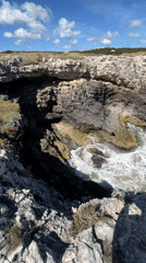 Tourists explore traditional fishing platforms along Peschici's Adriatic coastline