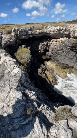 Tourists explore traditional fishing platforms along Peschici's Adriatic coastline
