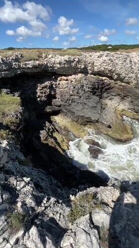 Tourists explore traditional fishing platforms along Peschici's Adriatic coastline