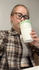Woman drinks from cup in Saint Petersburg