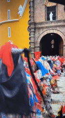 Traditional costumed dancers perform street celebration in Tinaquillo, Venezuela