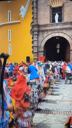 Traditional costumed dancers perform street celebration in Tinaquillo, Venezuela
