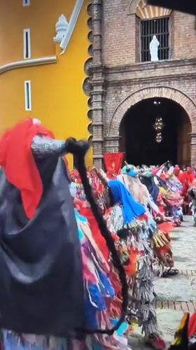 Traditional costumed dancers perform street celebration in Tinaquillo, Venezuela