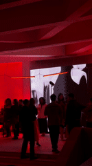 Social gathering with DJs at red-lit venue in Yerevan