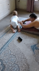 Quiet floor time with a baby on a rug in Baku