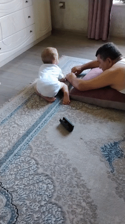 Quiet floor time with a baby on a rug in Baku