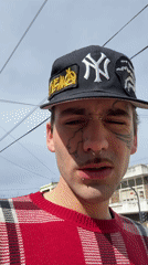 Tattooed youth smoking outdoors in Buenos Aires