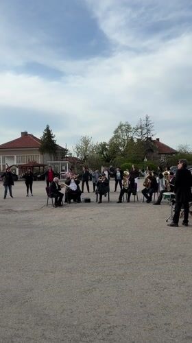 Brass band draws dancing crowd in Bulgarian town square