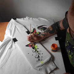 Hand-painted hoodie and wildflowers on a Riga afternoon