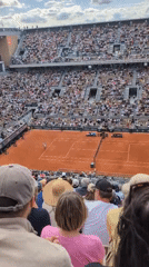 Tennis match underway at packed Paris stadium